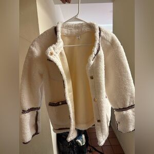 Cream white blazer with golden jewelry detailing 
Size M
Never worn